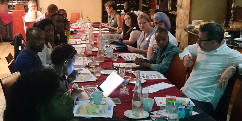 Young co-researchers sat around the table