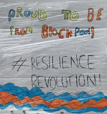 Hand-drawn sign saying "Proud to be from Blackpool #ResilienceRevolution"