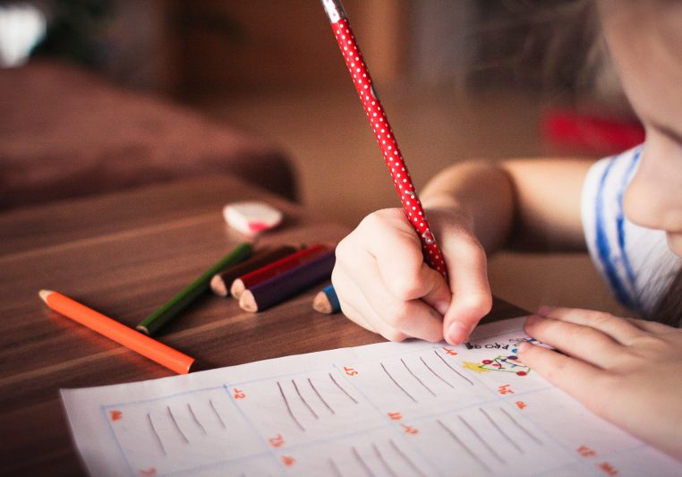 Child doing schoolwork at home